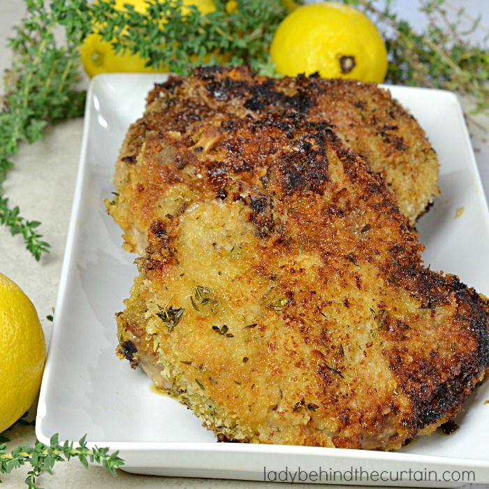 Honey Mustard Pork Chops | Who doesn't love a pork chop that is packed with layers of flavor? I know I do.....that's why this is my all time favorite pork chop recipe. Starting with a honey mustard coating and the perfect crust combination of bread crumbs, thyme and lemon zest. These chops were just as good the next day as the first.