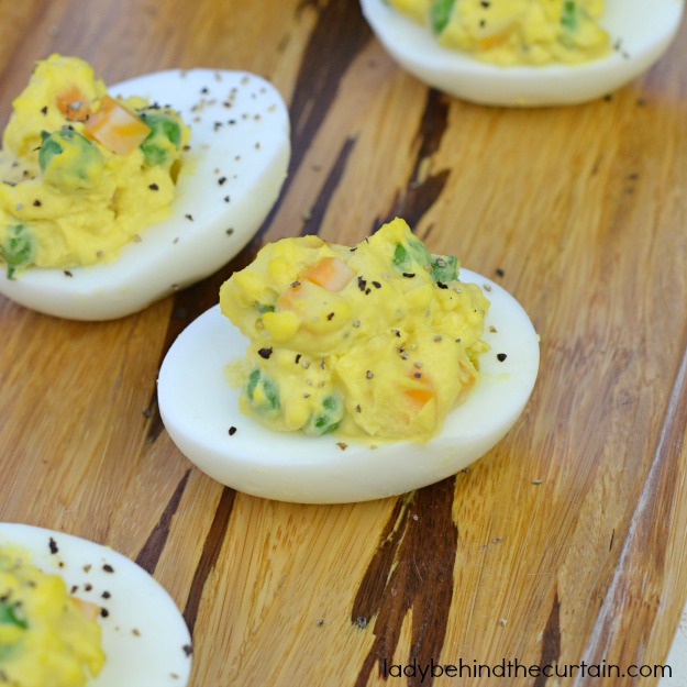 Cheesy Peasy Deviled Eggs - Lady Behind The Curtain