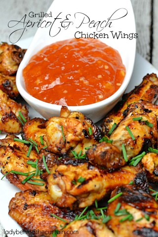 Grilled Apricot and Peach Chicken Wings | These grilled chicken wings are drenched in a sweet saucy mixture of fresh peaches with a delicious dipping sauce made from apricot jam.