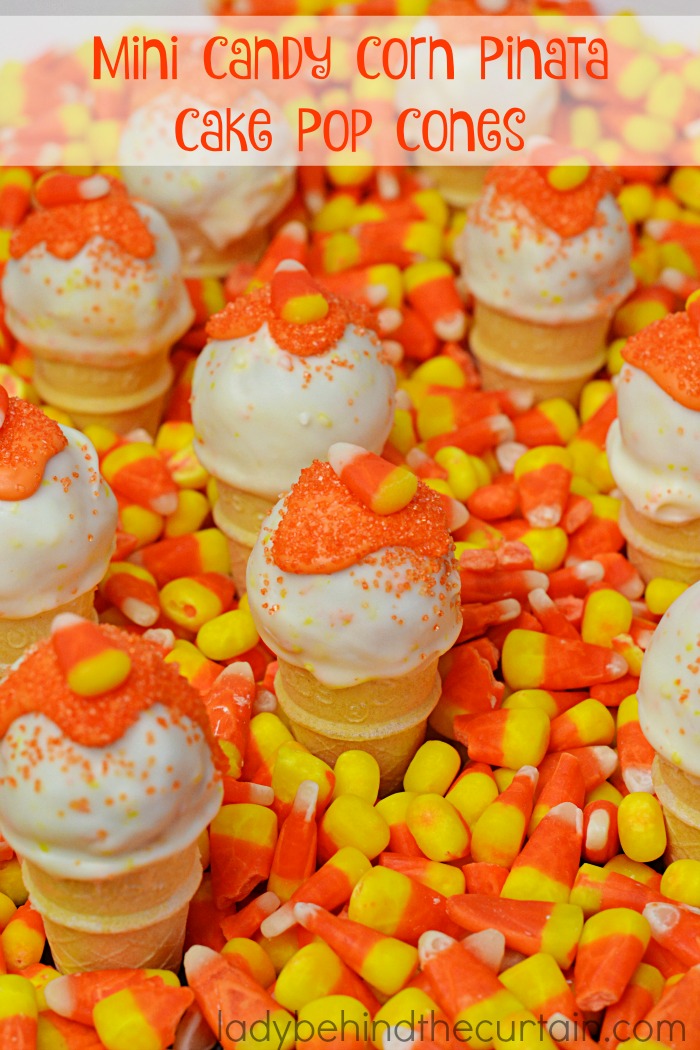 Mini Candy Corn Pinata Cake Pop Cones | Two treats in one! A delicious candy corn cake pop on top and candy corn on the inside!