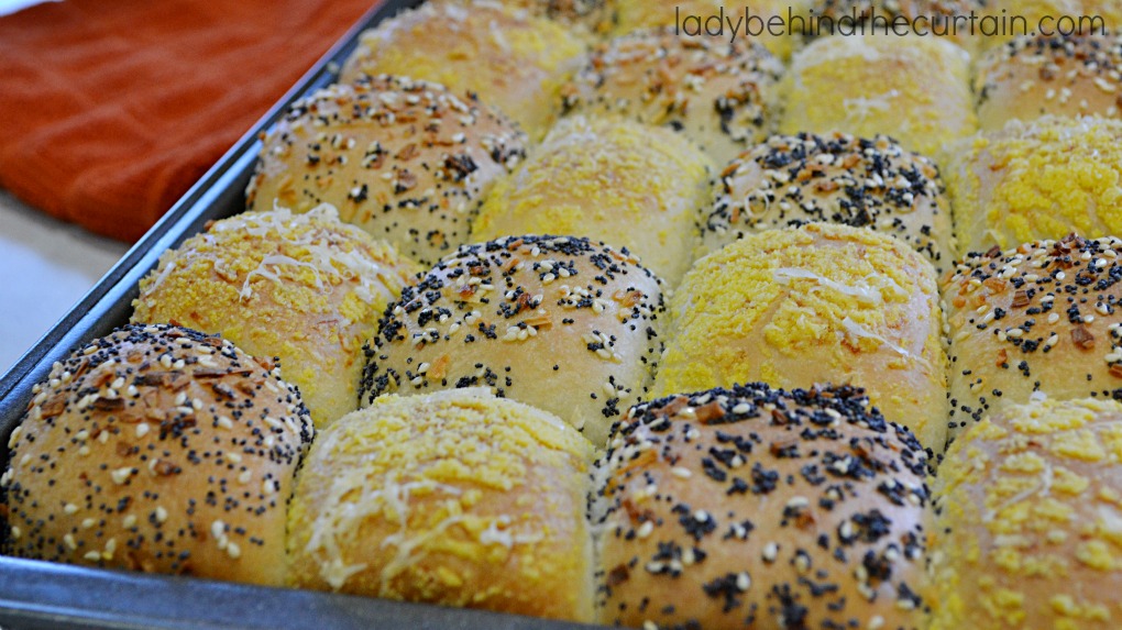 Semi Homemade Checkerboard Rolls | Tender tasty rolls. Some of the rolls have been rolled in seeds, minced onions while the other half of the rolls are rolled in corn meal and Romano cheese. Now that's a tasty roll!