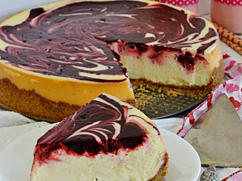 Red Velvet Swirl Cheesecake | A delightful mixture of the timeless red velvet favorite paired with a silky cheesecake. Simply the perfect Valentine's Day Dessert!