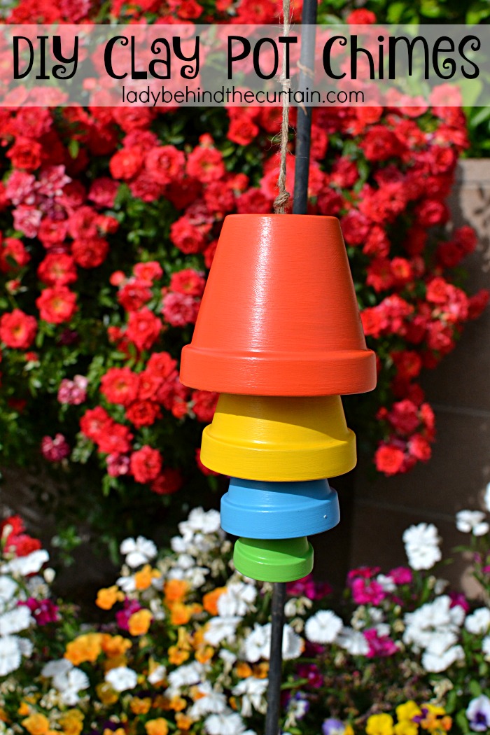 DIY Clay Pot Chimes | Add a pop of color to your backyard with these easy to make chimes. So much Summertime fun!