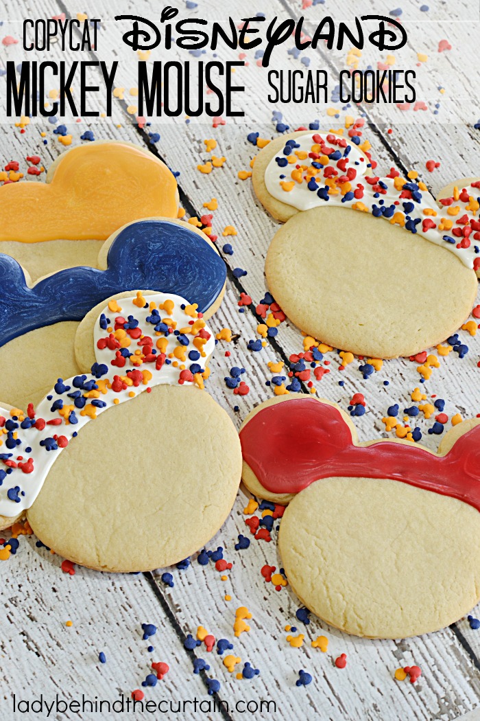 Copycat Disneyland Mickey Mouse Sugar Cookies | These giant cookies have a delicious butter flavor with just the right amount of softness and dipped in melted candy.