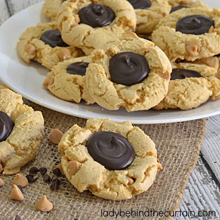 Peanut Butter Cup Cake Mix Cookie Recipe | If you are a fan of peanut butter cups or if you know someone who is.....then this is the cookie for you! The perfect chewy cookie! With a rich peanut butter cookie and a dark chocolate center to cut the richness.
