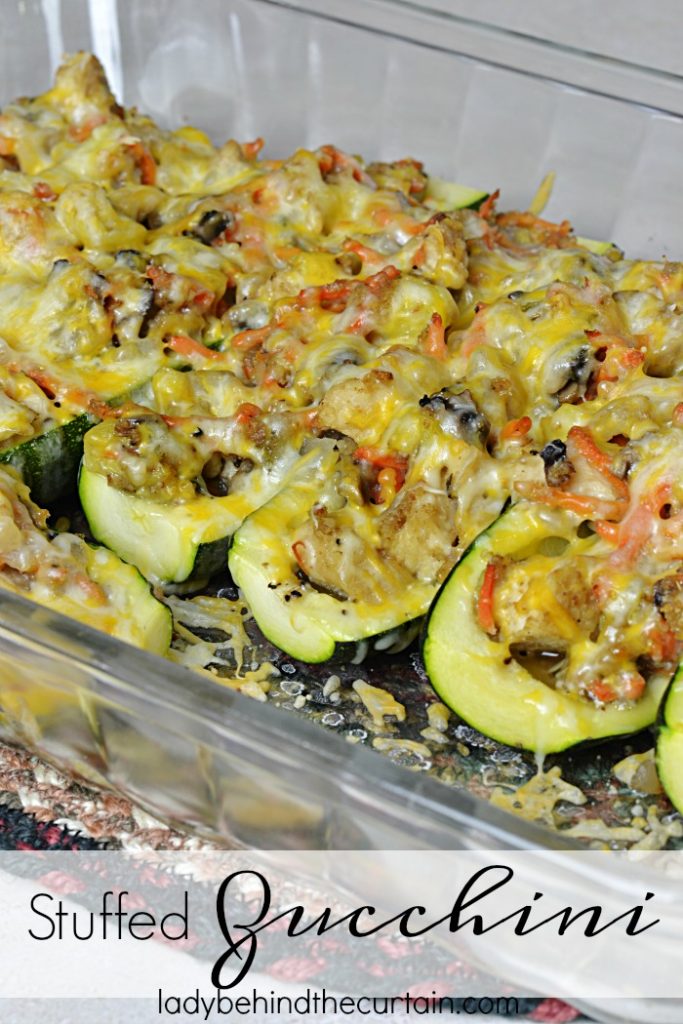 Stuffed Zucchini | Hollowed out zucchini filled with chicken, mushrooms, carrots and more great ingredients to make this the best light summer dish!