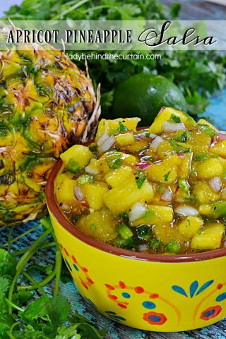 Apricot Pineapple Salsa | The perfect blend of sweet and spicy. This easy to make salsa will take whatever you serve it with up to the next level. With big chunks of fresh pineapple, apricot preserves and the salsa favorites of cilantro, lime juice, jalapeno and a few other ingredients you better make sure you double the recipe!