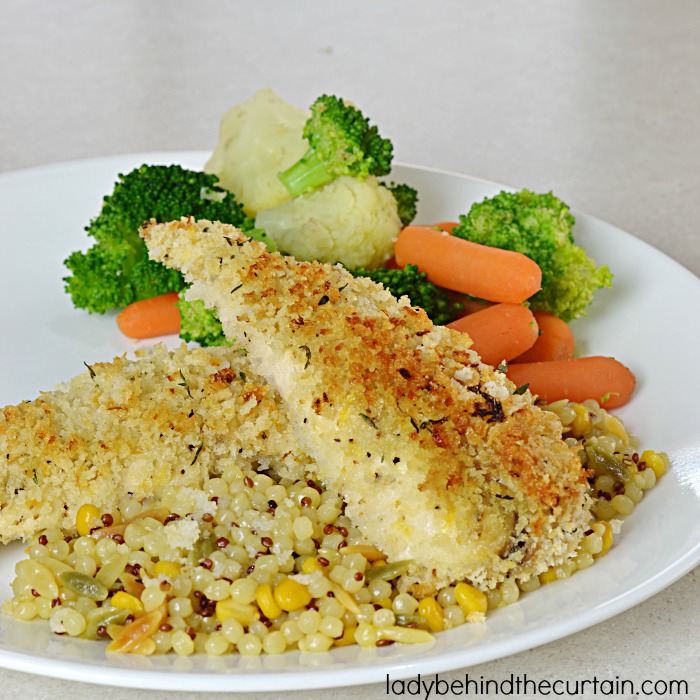Crunchy Lemonade Chicken Tenders | These chicken tenders are nice and crunchy without frying and full of the light and bright lemon flavor. 