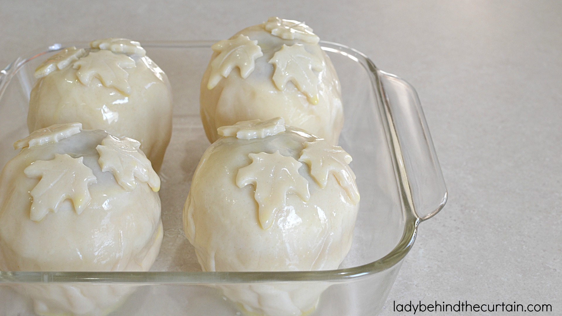 Sweet Apple Dumplings | There are many ways to make apple dumplings... this is my favorite. Plump and juicy in the inside encased with a crispy crust and topped with a drizzle of maple cream.