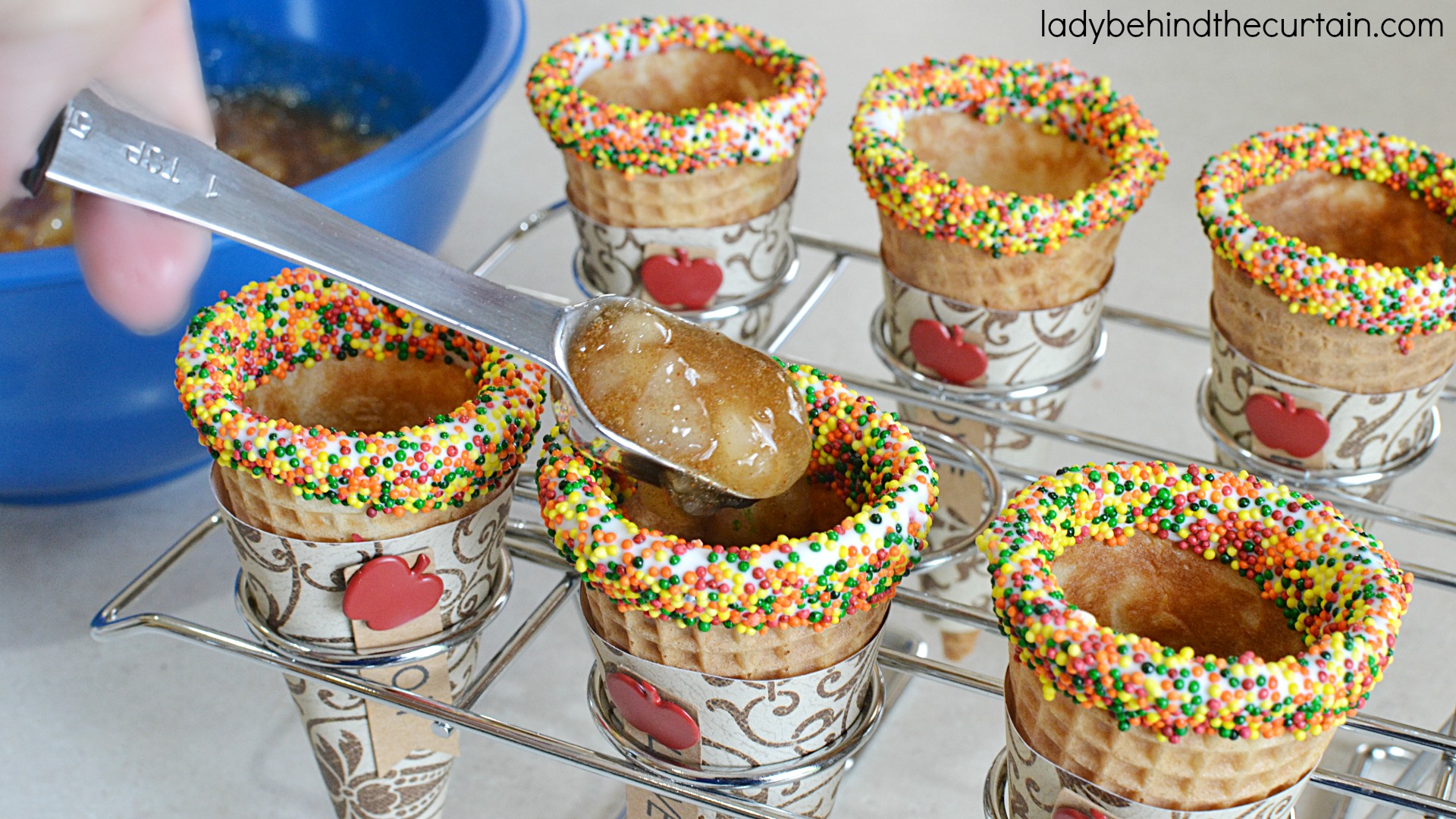 Apple Pie Cheesecake Filled Cones | These fun cones are filled with delicious fluffy cheesecake and little pockets of apple pie filling. A fun and easy was to serve your guests no bake cheesecake!