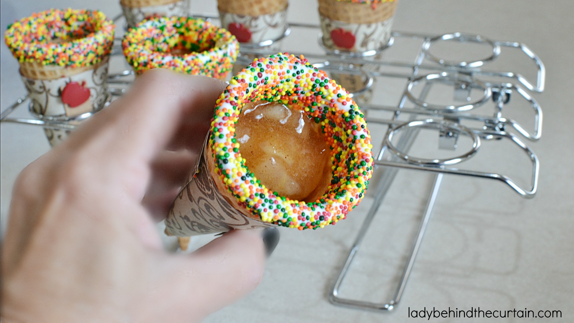 Apple Pie Cheesecake Filled Cones | These fun cones are filled with delicious fluffy cheesecake and little pockets of apple pie filling. A fun and easy was to serve your guests no bake cheesecake!