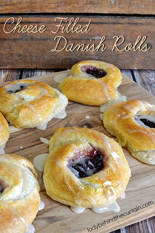 Cheese Filled Danish Rolls | Start with store bought crescent rolls, with cheesecake filling and a dollop of jelly. These giant rolls are everything you love about danish rolls.