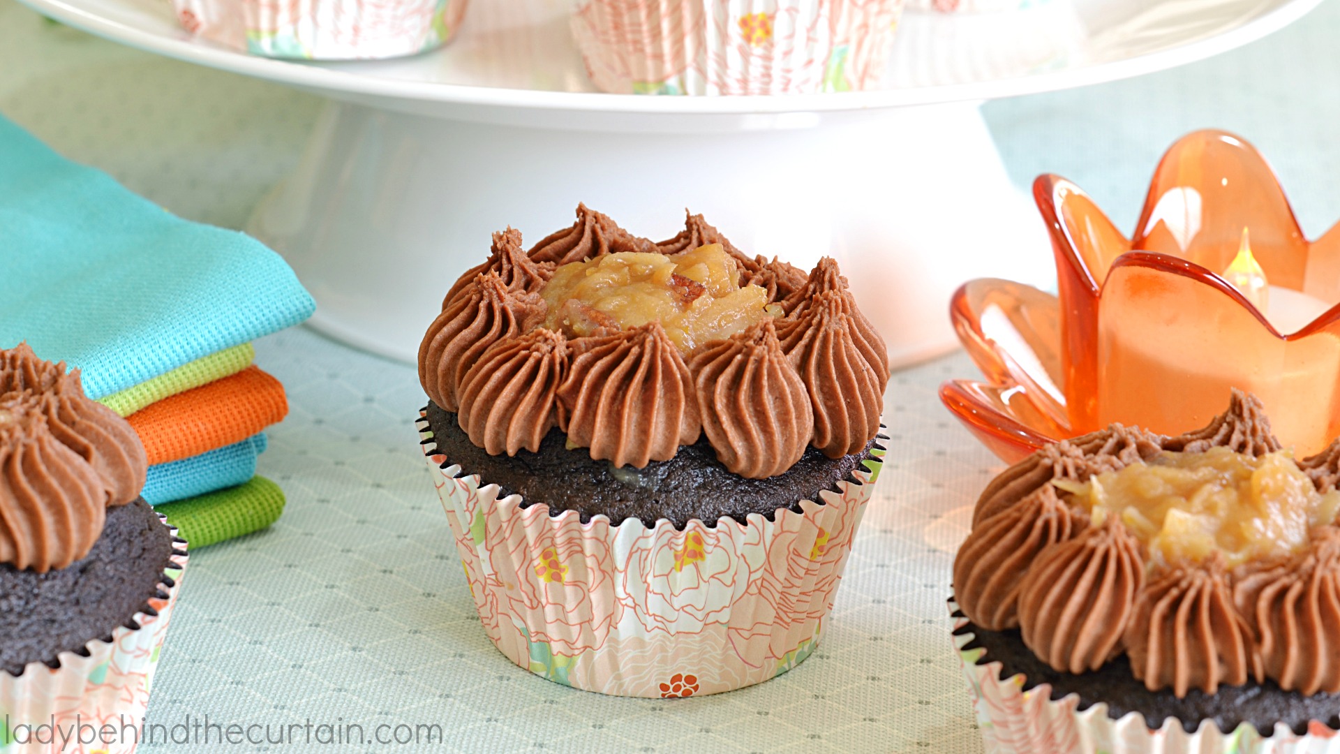 German Chocolate Cupcakes | A deep chocolate cupcake filled with the delicious coconut frosting that we all love along with a creamy butter chocolate frosting. The perfect chocolate cupcake!