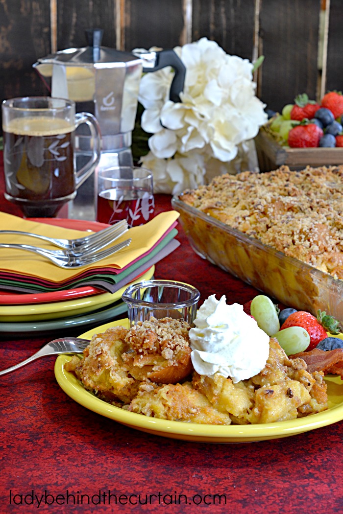 Pumpkin Pecan Bread Pudding Recipe | This semi homemade bread pudding is the best! With layers of cream soaked Challah bread, dollops of pumpkin pie and a pecan streusel on top that is to die for. 