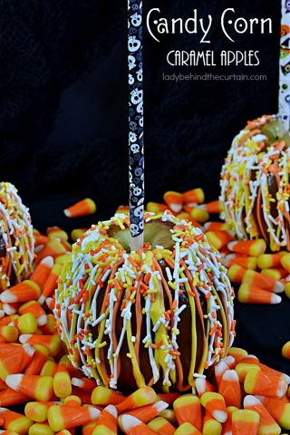 Candy Corn Caramel Apples | Your favorite apple dipped in easy to make caramel and drizzled with festive candy melts plus candy corn colored sprinkles! Perfect for your Halloween Party, Carnival or Fall Festival!