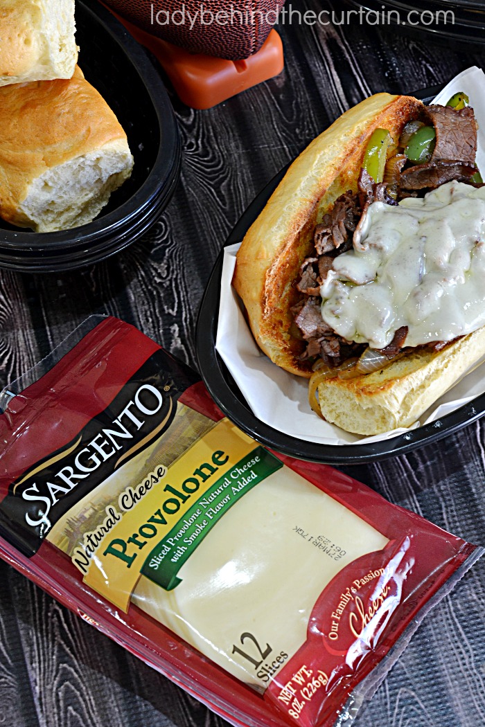 Game Day Cheese Steak Sandwich | This sandwich is piled high with roast beef, peppers and onions but the star of the show is the creamy cheese. 