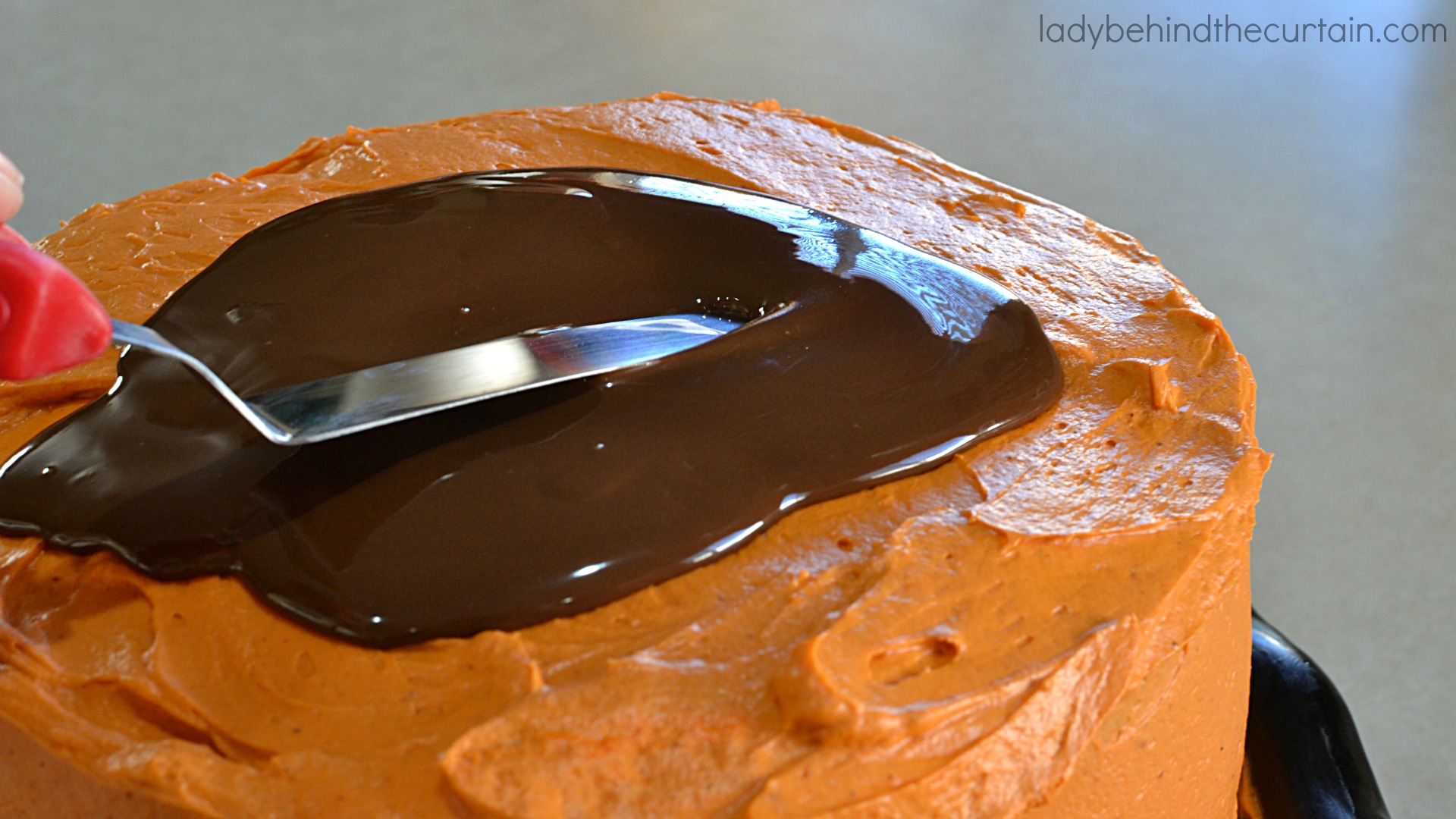 Halloween Chocolate Pumpkin Cake | This cake will be a hit at your Halloween party it not only delivers in flavor but also adds a touch of creepiness to your party table.