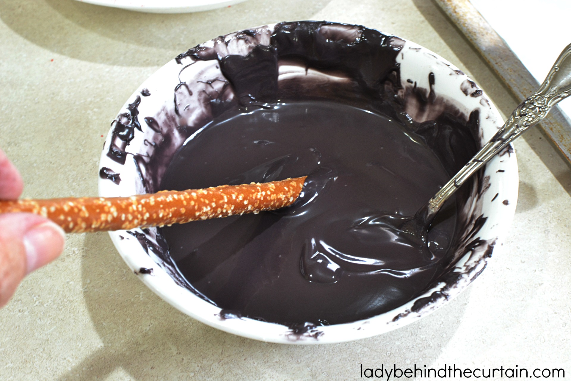 Halloween Vampire Pretzels | These bloody creations are perfect for any scary themed Halloween Party. With the perfect balance of sweet and salty no one with care that there is blood dripping down their pretzel.
