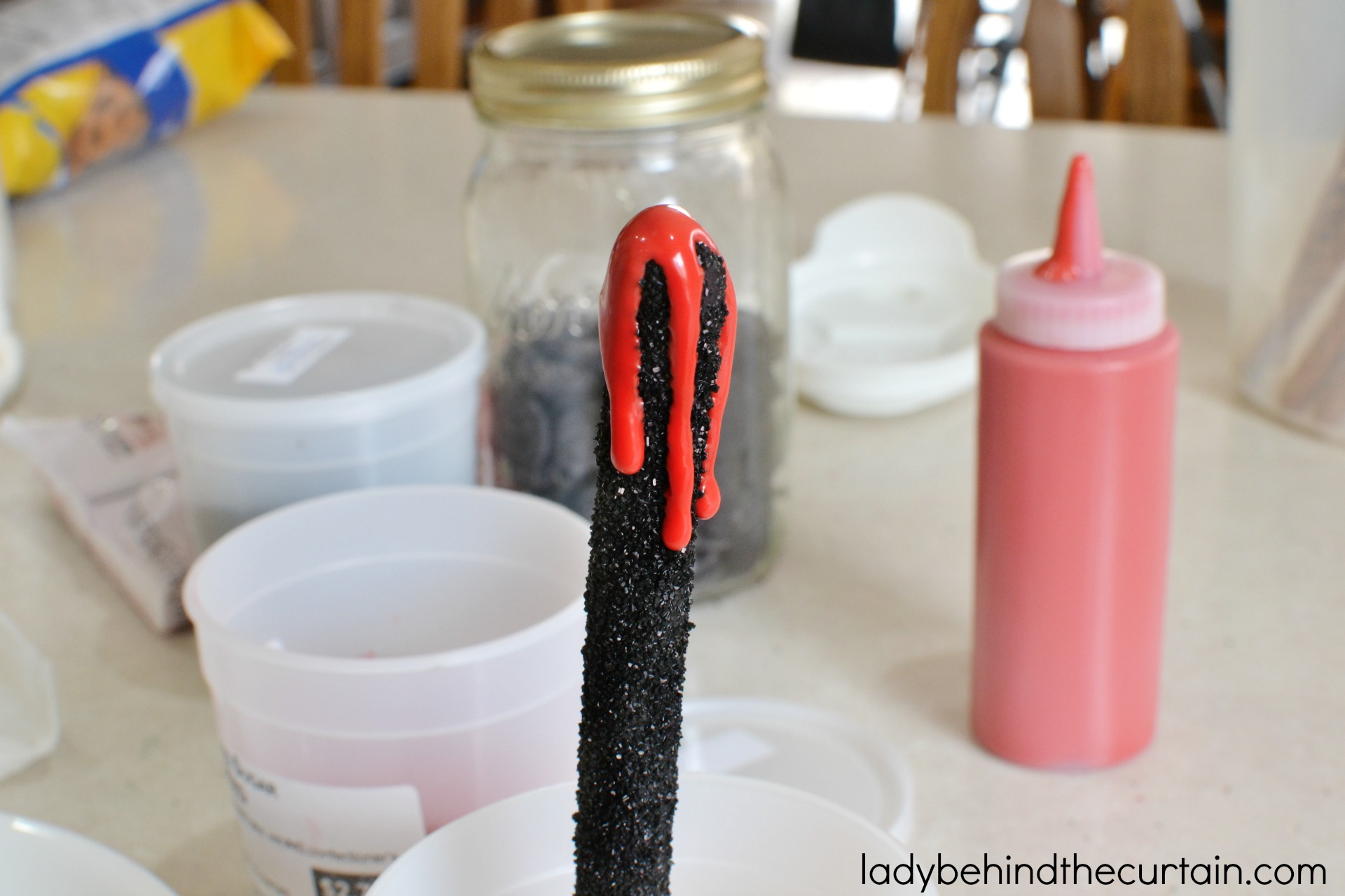 Halloween Vampire Pretzels | These bloody creations are perfect for any scary themed Halloween Party. With the perfect balance of sweet and salty no one with care that there is blood dripping down their pretzel.