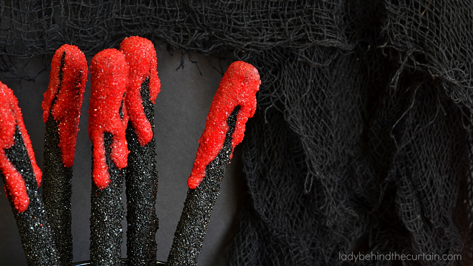 Halloween Vampire Pretzels | These bloody creations are perfect for any scary themed Halloween Party. With the perfect balance of sweet and salty no one with care that there is blood dripping down their pretzel.