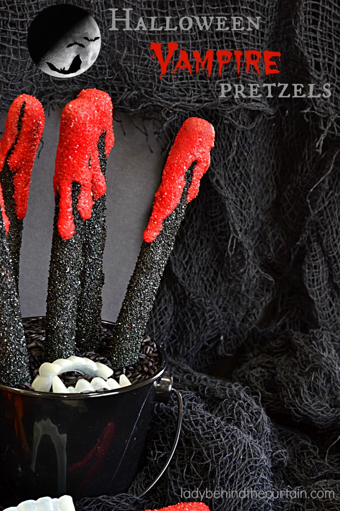 Halloween Vampire Pretzels | These bloody creations are perfect for any scary themed Halloween Party. With the perfect balance of sweet and salty no one with care that there is blood dripping down their pretzel.