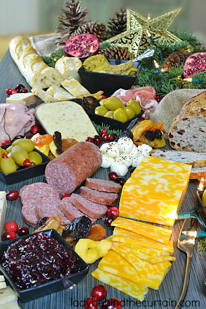 How to Build the Ultimate Holiday Charcuterie Board | When it comes to creating a fun party atmosphere I always turn to a Charcuterie Board. This wonderful board is filled with an assortment of meats, cheeses, spreads, dried fruit and more.
