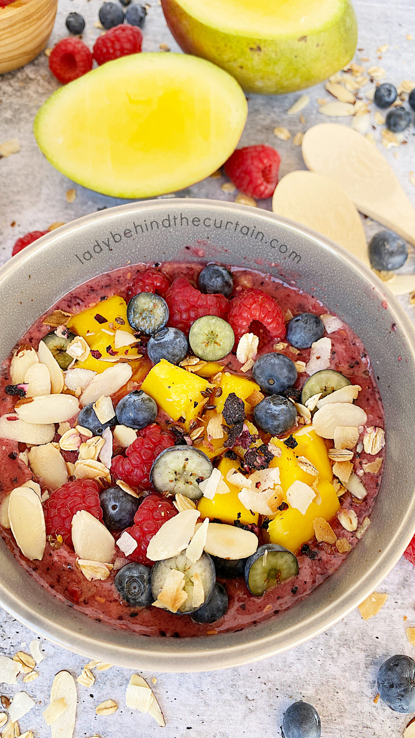 https://www.ladybehindthecurtain.com/wp-content/uploads/2022/07/Tropical-Smoothie-Bowl-with-Toasted-Topping-5-scaled.jpg