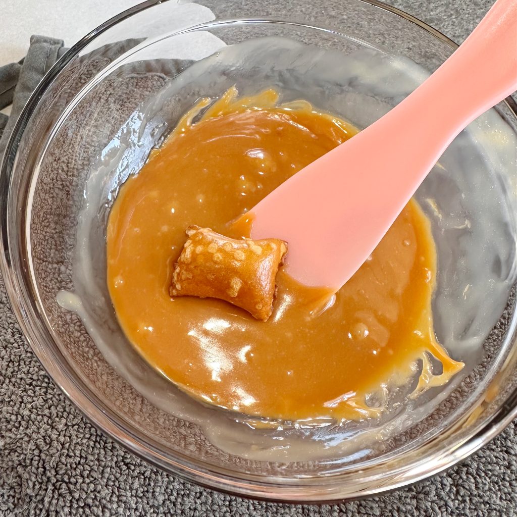 Peanut Butter Pretzel Caramel Candy Bar Bites Dipped in Milk Chocolate